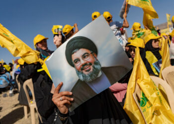 BEKAA VALLEY, LEBANON - MAY 13: A woman holds a photo of Hassan Nasrallah, Secretary-General of Hezbollah pior the Hezbollah Political Party Rally to commemorate the anniversary of Badreddine death on May 13, 2022 in Baalbek in Bekaa Valley, Lebanon. On May 15 Lebanese will be heading to polls for the first time since the financial collapse and the protest movement of 2019. (Photo by Francesca Volpi/Getty Images)